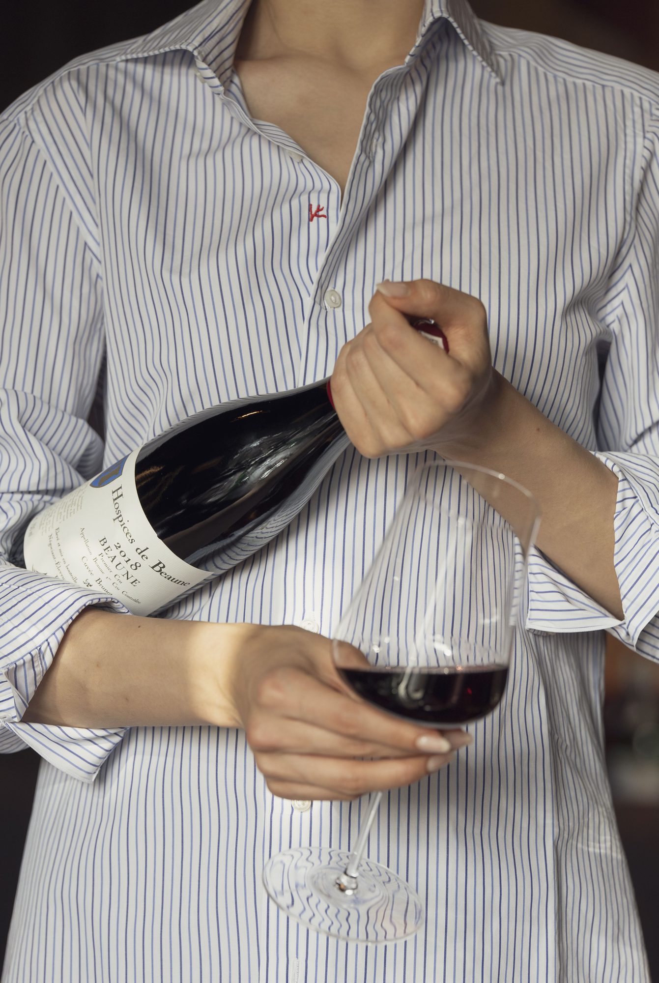 Red wine poured at a table in the dining room