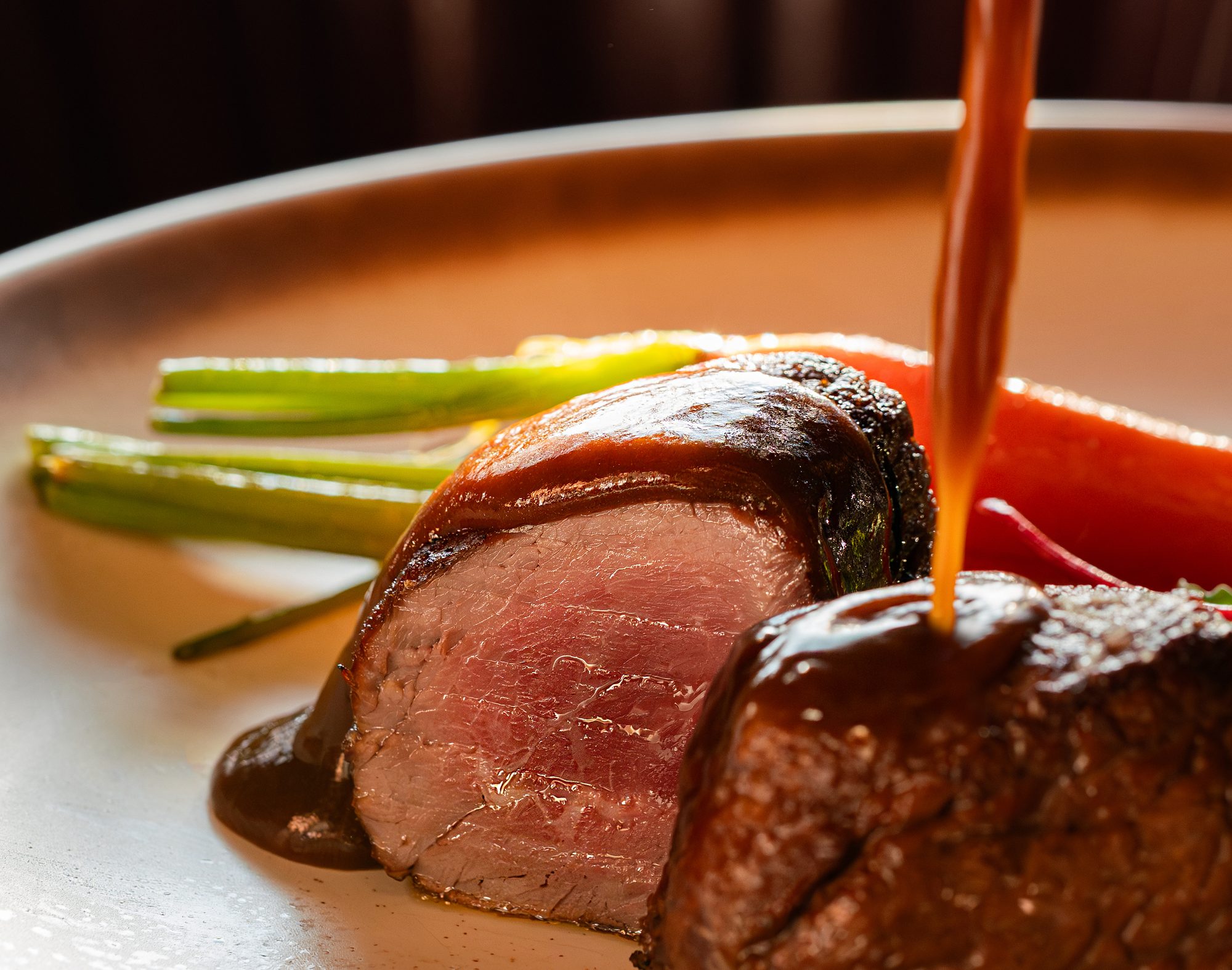 Beef fillet with garden carrots and salad leaves